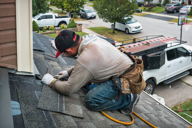 Professional Roof Leak Repair technician working in Wheelwright, MA